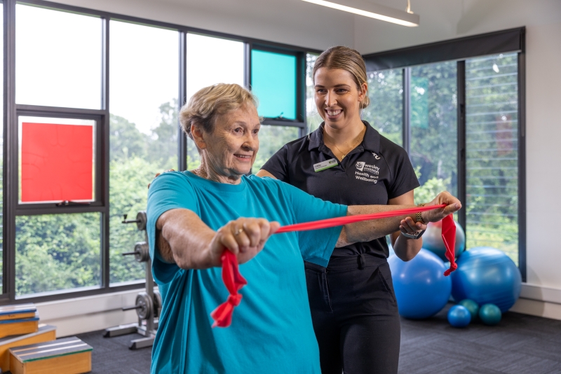 Senior health and wellbeing client and allied health professional in a session, located at Hyland House, Petrie