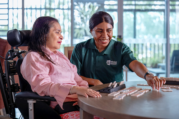Staff and resident in a disability accommodation in Brisbane