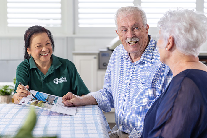 Home Care Brisbane - Staff and couple discussing services and costs