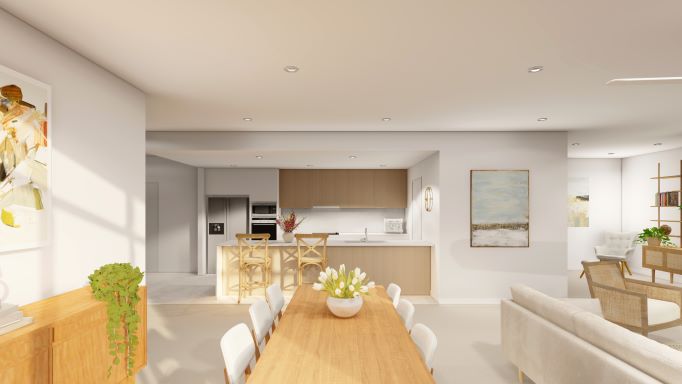 Kitchen overlooking dining and living space View over long dining table towards kitchen