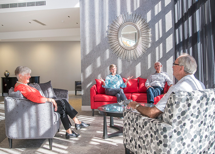Group of retirees at entry lounge in Rosemount Retirement Village