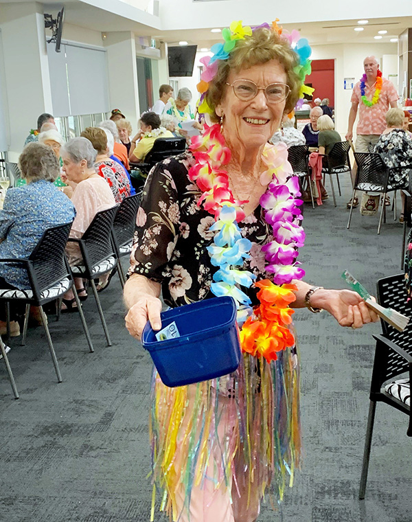 Resident dressed-up at Hawaiian BBQ night on Wheller on the Park retirement community
