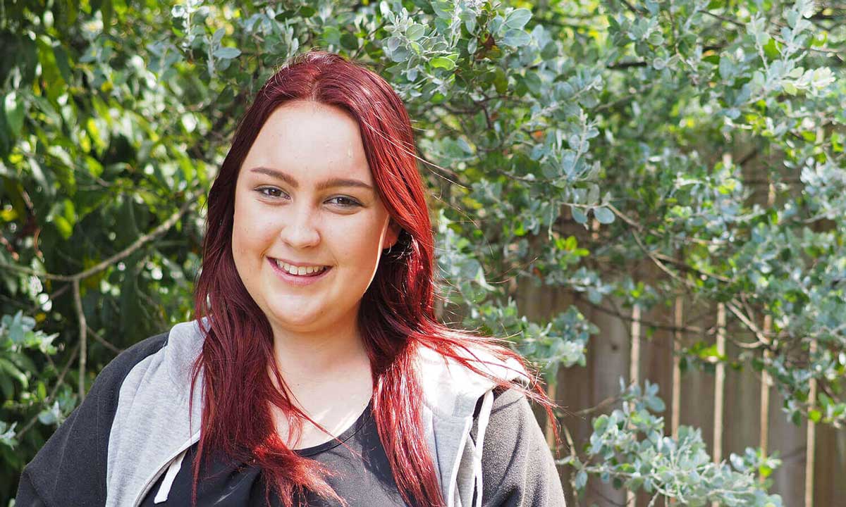 Jess is a client of Logan Youth Foyer service young woman outside smiling